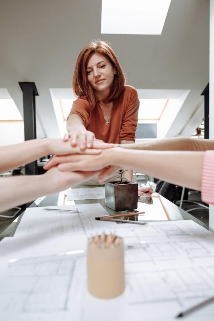 A Group of People with Their Hands Together